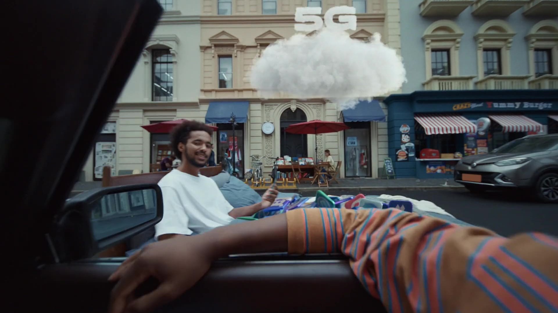 A bed carried into the street under a cloud marked 5G.